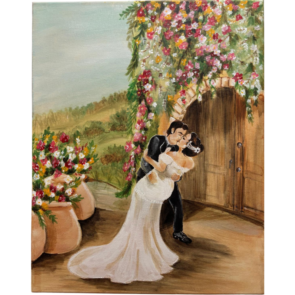 Original acrylic wedding painting of a bride and groom sharing a romantic dip kiss beneath a colorful floral arch beside rustic wooden doors, with rolling green hills in the background.